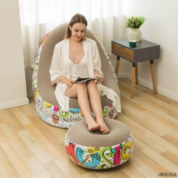 Inflatable seat with footrest