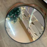 Hanging mirror with leather strap