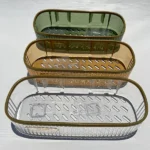 Gold, green, and clear bathroom shelving