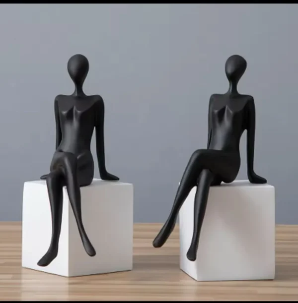 Sitting figure bookshelf décor